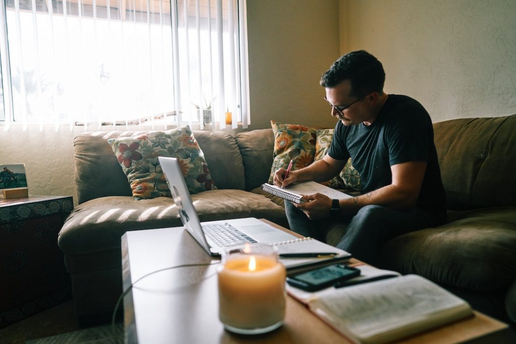 man working on couch