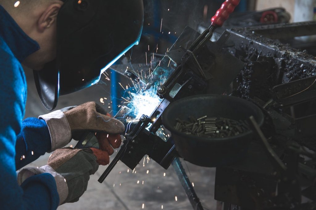 man-welding-daniel-wiadro-GAEvM4qvlBk-unsplash