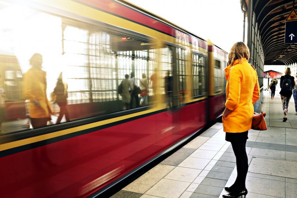woman-standing-by-train-pexels-life-of-pix-21410