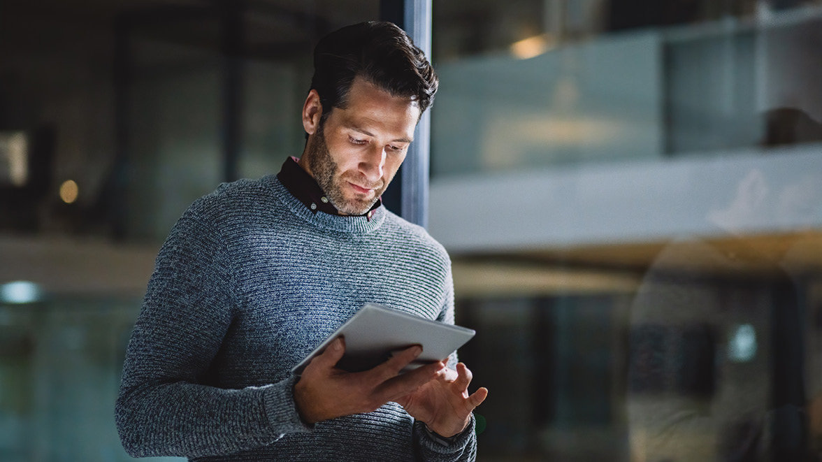 Male using a smart device or tablet