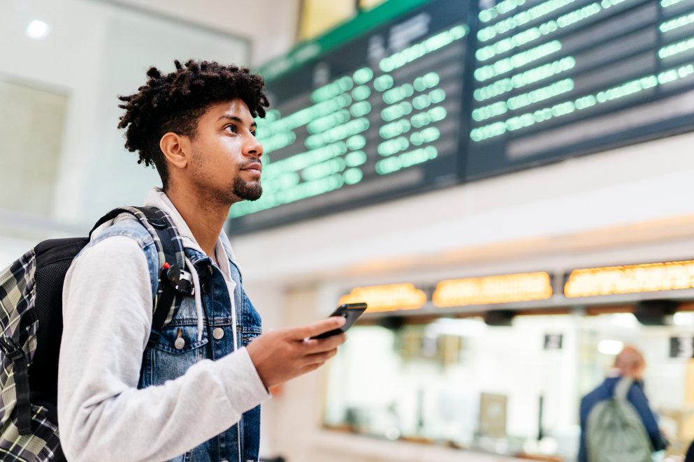 Man using a smart phone looking up