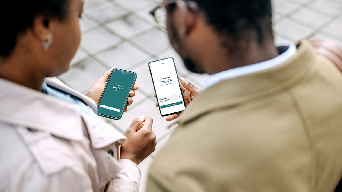 People using mobile device for payments