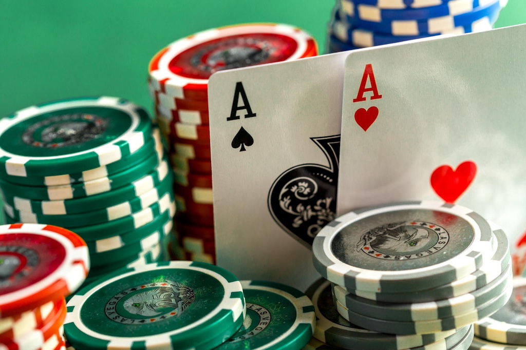 citiio-cards-chips-poker-green-table_93675-132861